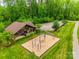 An outdoor pavilion is near a playground with swing set, picnic tables, and plenty of shade trees at 724 Lagan Ct, Fort Mill, SC 29715