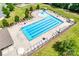Aerial view of a community pool with lap lanes, lounge chairs, and well-maintained landscaping at 724 Lagan Ct, Fort Mill, SC 29715