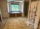 Bathroom featuring tile flooring, a garden tub with brick detail, and a decorative shower curtain at 7494 Flat Creek Rd, Lancaster, SC 29720
