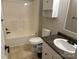 Bright bathroom featuring a shower-tub combo, toilet, and a vanity with a sink, perfect for everyday convenience at 7494 Flat Creek Rd, Lancaster, SC 29720