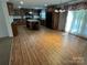 Spacious kitchen area featuring wood cabinets, a large island, and abundant natural light from the sliding glass doors at 7494 Flat Creek Rd, Lancaster, SC 29720