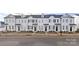 Attractive new construction townhomes with coordinating landscaping and sidewalk at 8118 Jacey Ln # 20, Huntersville, NC 28078