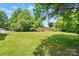 Large grassy backyard offering ample space and privacy for outdoor activities and landscaping opportunities at 842 Murphy St, Kannapolis, NC 28081