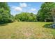 Large grassy backyard offering ample space and privacy for outdoor activities and landscaping opportunities at 842 Murphy St, Kannapolis, NC 28081