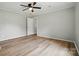 Airy bedroom featuring vinyl plank flooring, a ceiling fan, and a walk-in closet at 842 Murphy St, Kannapolis, NC 28081