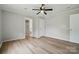 An open bedroom offering vinyl flooring, a ceiling fan, and an ensuite bathroom at 842 Murphy St, Kannapolis, NC 28081