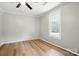 Neutral bedroom featuring vinyl floors, a large window, and overhead lighting at 842 Murphy St, Kannapolis, NC 28081