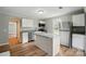 Modern kitchen design featuring stainless steel appliances and an island with stone countertop at 842 Murphy St, Kannapolis, NC 28081