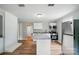 Bright, open kitchen with stainless appliances, white cabinetry, and stone countertops at 842 Murphy St, Kannapolis, NC 28081