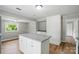 Kitchen featuring an island with stone countertops and stainless steel appliances at 842 Murphy St, Kannapolis, NC 28081
