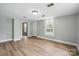 Bright living room with wood floors and ample natural light at 842 Murphy St, Kannapolis, NC 28081