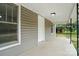 Covered porch with concrete floor and fresh, bright trim at 842 Murphy St, Kannapolis, NC 28081