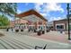 Charming exterior shot of town square with benches, tables, trees, and commercial buildings at 842 Murphy St, Kannapolis, NC 28081