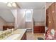 Spacious bathroom featuring a granite countertop vanity and shower with a decorative floral curtain at 945 Songbird St, Lancaster, SC 29720