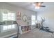 Bright bedroom featuring neutral walls, carpet, shelving, and fitness equipment at 945 Songbird St, Lancaster, SC 29720