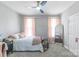 Comfortable bedroom with neutral walls, carpet flooring, and abundant natural light at 945 Songbird St, Lancaster, SC 29720