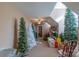 Open bonus room featuring multiple Christmas trees, storage, and natural light at 945 Songbird St, Lancaster, SC 29720