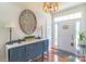 Elegant entryway showcasing a stylish console table, a decorative wall art, and a well-lit, inviting space at 945 Songbird St, Lancaster, SC 29720