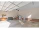 Spacious two-car garage showcasing clean floors, extra storage, and ample room at 945 Songbird St, Lancaster, SC 29720