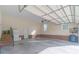 Clean two-car garage boasting ample storage, brick accents, and natural light at 945 Songbird St, Lancaster, SC 29720