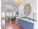 Open living space featuring hardwood floors, decorative console table, a chandelier, and seamless flow at 945 Songbird St, Lancaster, SC 29720