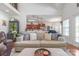 Inviting living room with neutral decor and an open layout to the kitchen and dining area at 945 Songbird St, Lancaster, SC 29720