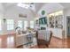 Bright living room with vaulted ceilings, fireplace, built-in shelving, and hardwood floors at 945 Songbird St, Lancaster, SC 29720