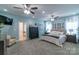 Spacious main bedroom featuring light blue walls, carpet, and ensuite bathroom at 945 Songbird St, Lancaster, SC 29720
