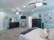 Large main bedroom with light blue walls, carpet, ceiling fans and ensuite bathroom at 945 Songbird St, Lancaster, SC 29720