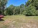 Backyard featuring a large grassy lot and treeline at 9565 Man O War Rd, Indian Land, SC 29707