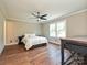 Bedroom features hardwood floors, neutral walls, and a ceiling fan at 9565 Man O War Rd, Indian Land, SC 29707