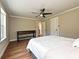 Bedroom boasts hardwood floors, neutral walls, ceiling fan, and natural light at 9565 Man O War Rd, Indian Land, SC 29707