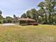 Exterior rear view of a home with a large yard and deck at 9565 Man O War Rd, Indian Land, SC 29707