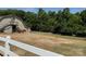 View of barn with horses in a fenced pasture at 9565 Man O War Rd, Indian Land, SC 29707