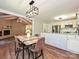 Bright eat in kitchen view flowing into the living room fireplace at 9565 Man O War Rd, Indian Land, SC 29707