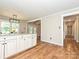 Kitchen with breakfast nook and granite countertops flows to living and bedroom area at 9565 Man O War Rd, Indian Land, SC 29707