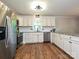 Kitchen features stainless appliances, granite countertops, subway tile backsplash, and modern cabinetry at 9565 Man O War Rd, Indian Land, SC 29707