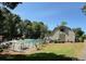 Community pool area with barn-like structure and landscaping, perfect for relaxation and recreation at 9565 Man O War Rd, Indian Land, SC 29707