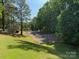 Community tennis courts surrounded by lush greenery, offering a recreational space for residents at 9565 Man O War Rd, Indian Land, SC 29707