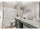 Bathroom with a shower, vanity, and decorative accents at 10011 Spring Park Dr, Charlotte, NC 28269