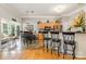 Open concept breakfast nook flowing into the kitchen, and outdoor sitting area at 10011 Spring Park Dr, Charlotte, NC 28269