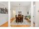 Traditional dining room with wood table, seating for six, and light hardwood floors at 10011 Spring Park Dr, Charlotte, NC 28269