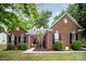 Charming one-story brick home with manicured lawn and inviting entrance at 10011 Spring Park Dr, Charlotte, NC 28269
