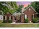Charming one-story brick home with manicured lawn and inviting entrance at 10011 Spring Park Dr, Charlotte, NC 28269