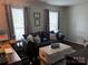 Cozy living room featuring a comfortable couch, neutral tones, and natural light at 10011 Spring Park Dr, Charlotte, NC 28269