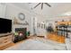 Bright, open living room with fireplace flowing into the dining and kitchen area at 10011 Spring Park Dr, Charlotte, NC 28269