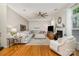 Bright and airy living room with hardwood floors, plush seating, fireplace, and modern decor at 10011 Spring Park Dr, Charlotte, NC 28269