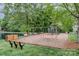Community playground near pond with swingset and slide at 10011 Spring Park Dr, Charlotte, NC 28269