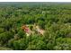 Aerial perspective of the property in a verdant, wooded neighborhood at 1012 W Carroll St, Cherryville, NC 28021