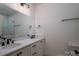 Bright bathroom featuring double sinks, white cabinetry, and matte black hardware at 1012 W Carroll St, Cherryville, NC 28021